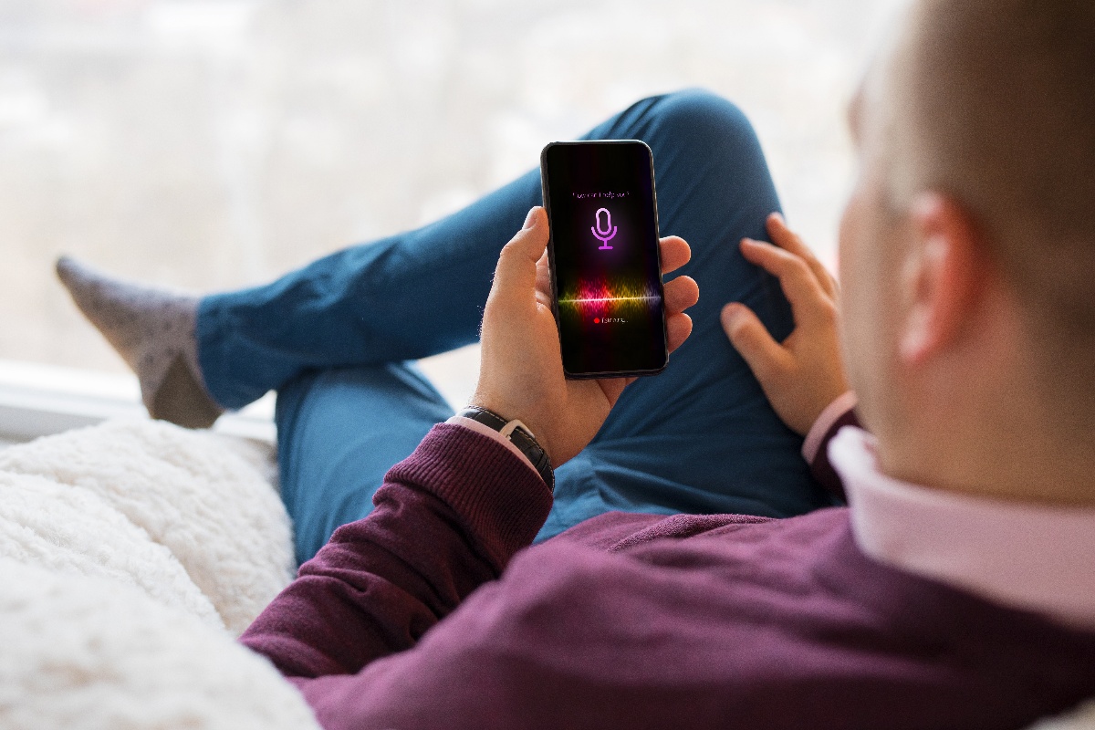 man using digital voice assistant on phone